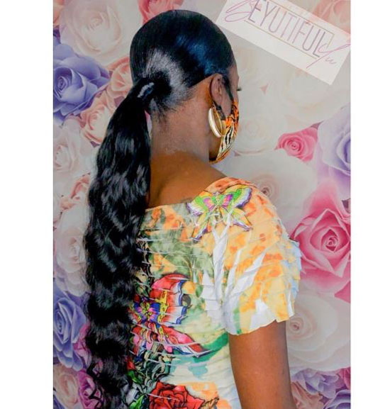 Sleek Curly Middle Part Low Pony